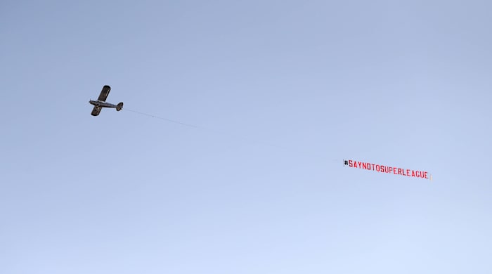 A plane flying over Old Trafford protesting the Super League.